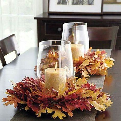 Wreath of colorful leaves provide the base for a pillar candle | DIY Fall Candle Decoration Ideas - Farmfoodfamily.com Thanksgiving Leaves, Fall Centerpieces, Autumn Table, Fall Thanksgiving Decor, Fall Deco, Autumn Decorating, Thanksgiving Centerpieces, Fall Decorating Ideas, Fall Decoration