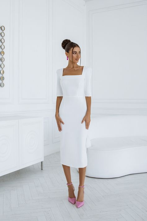 Step into timeless charm with our White Square Neckline Midi Dress. The clean lines and midi length create a versatile and flattering silhouette, ideal for both casual and dressy occasions. #whitedress #mididress #dresses #stylish #eveningdress #partydress #promdress #dresslover #womendress #womenstyle #dressup #fashion White Modest Graduation Dress, Elegant Dresses For Graduation, Long Sleeve Midi White Dress, White Dress Graduation Classy, Elegant Midi Dress Classy, Modest Graduation Dress, Elegant White Gown, Midi Dress Classy, White Dress Classy