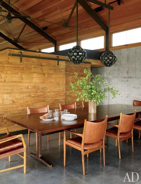 Vintage Lightolier pendants from 20th Century Gallery are paired with a custom-made walnut table and circa-1960 teak-and-leather chairs by Hans J. Wegner from Hostler Burrows in the dining room. Old Mid Century Rustic Dining Table, Pierre Jeanneret Dining Room, Midcentury Modern Dining Room, G Plan Dining Table Teak, Hans Wegner Chair Dining Rooms, Mid Century Modern Dining Room, Montana Homes, Dining Room Contemporary, Mid Century Modern Dining