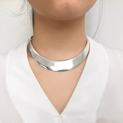 Thick Torque Collar Sterling Silver Necklace With its minimalist, Scandinavian classic design, our sterling silver torque necklace is simple and chic. So easy to put on and take off, it couldn't be easier to look sensational with this solid silver choker necklace! Available in 3 depths (band thickness measured at the widest point at the front). Specification: Front Thickness: 12mm / 16mm / 20...#Timeless #Exploring #Choker #A #Necklaces #Art #of #the #Fashion #of #Exploring #Allure #Statement Metal Collar Necklace, Silver Collar Necklace, Silver Chunky Necklace, Collar Necklace Outfit, Torque Necklaces, Jellyfish Project, Big Silver Necklace, Thick Silver Necklace, Mlp Redesigns