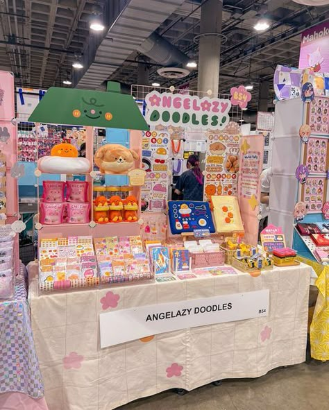 Angel  :•) on Instagram: "See u all at @animeexpo day 1 !! 💖  All set up at B54 with lots of goodies, so pls drop by if u can 🥹 and bring cash pls heehee  I’m so nervous 😭😭😭 hoping for a great day for all the artists and attendees !!!   #animeexpo #axartistalley2024 #ax2024 #animeexpo2024" Artist Merchandise Ideas, Booth Set Up, Creative Booth Design Exhibition Stands, Art Festival Booth Display, Festival Booth Display, Art Festival Booth, Booth Design Exhibition, Art Fair Display, Creative Booths