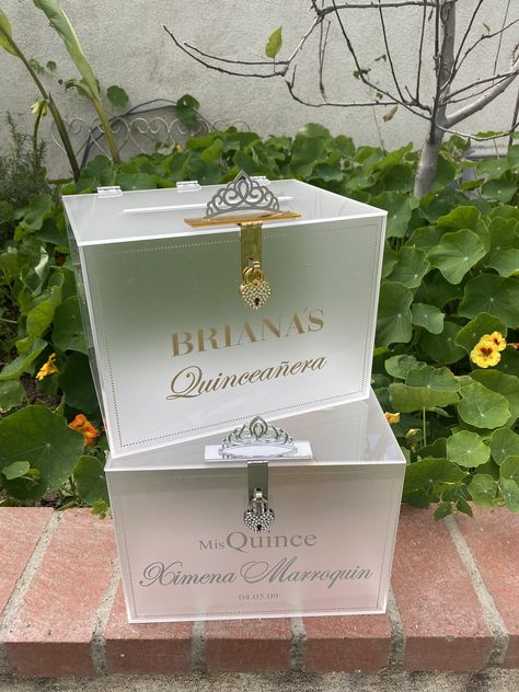 "This beautiful card box is perfect for keeping your Quinceanera cards organized during the reception and will hold 100 cards. It is made of frosted acrylic with ENGRAVED and PAINTED text. The box comes with a lock and key.  The color/style of locks available are: heart gold, heart silver, heart gold rhinestone, heart silver rhinestone, rectangular rhinestone gold, rectangular rhinestone   The font (as pictured) will be used for printing your card box.  - Pictured: Silver glitter & Silver Heart Acrylic Money Box Ideas, Quince Gifts, Light Up Box, Gift Card Boxes, Money Box, Quince, Silver Rhinestone, Personalised Box, Silver Glitter