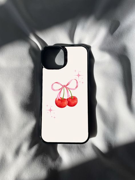 🍒💖 Indulge in the sweetness of style with our Pink Cherry Ribbon Print iPhone Case! 📱✨ This delightful accessory combines the playful charm of cherries with the elegance of ribbon patterns, creating a uniquely chic design that's perfect for the modern fashionista. 💕🎀 Ribbon Emoji, Phone Case Inspo, Phone Case Diy Paint, Trendy Phone Cases, Pink Cherry, Iphone Prints, Aesthetic Phone Case, Diy Phone Case, Iphone 16 Pro