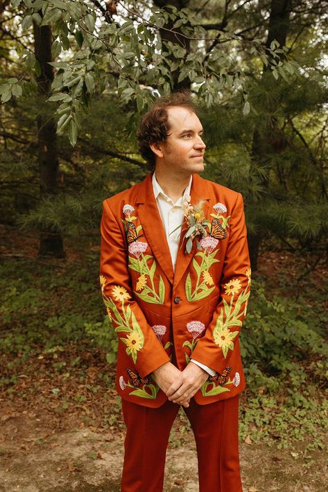 Groom wearing a red wedding suit with embroidered flowers and butterflies for a Greenhouse at Goldner Walsh wedding. See more groom attire ideas and groom suit inspiration. Book Marissa for your Michigan wedding photography at marissadillonphotography.com! Red Wedding Suit, Casual Groom Outfit, Alternative Groom Attire, Alternative Groom, Ring Warming Ceremony, Pontiac Michigan, Suit Inspiration, Unique Save The Dates, Most Beautiful Wedding Dresses