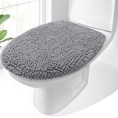 PRICES MAY VARY. [SOFT AND COMFORTABLE CHENILLE] Plush chenille topside is ultra soft and comfortable to sit on; premium fabric adds an extra layer of comfort while helping to protect your toilet lid from scratches and damage [STAYS IN PLACE] The robust rubber underside and sturdy elastic edges ensure the cover remains firmly in place. [FITS MOST TOILET LIDS] Our generously sized cover, measuring 17.5 by 15 inches, is designed to fit the majority of round and elongated toilet lids. The robust elastic edges enable the cover to adapt to your toilet lid's shape for a secure fit, though elongated lids may require additional effort during installation. [MACHINE WASHABLE] OLANLY cover can be machine washed separately with cold water, mild detergent which has no chlorine or bleach and tumble dry Elongated Toilet, Toilet Lid Cover, Bathroom Toilet, Hanging Dryer, Accessories Decor, Bathroom Toilets, Bathroom Rugs, Seat Covers, Tumble Dryer