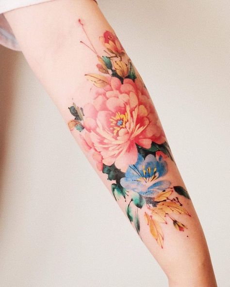 Forearm tattoos always make a statement. Yours will be personal and represent you in the best way it possibly can so you can show it off with pride! Floral Watercolor Tattoo, Watercolor Tattoo Sleeve, Around Arm Tattoo, Floral Tattoo Sleeve, Tattoos Geometric, Forearm Tattoo Women, Peonies Tattoo, Arm Tattoos For Women