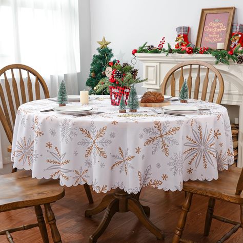 PRICES MAY VARY. High Quality: This Christmas tablecloth is made of high quality polyester. Sturdy sewing, soft, foldable and durable. Protect your table's surface from hot pans, scratches, and spills. Multi-purpose: These Christmas decorations are ideal for any occasions. Perfect for kitchen dining daily use themed party decoration, holiday and special events celebration. Fits Table Size: This Christmas tablecloth is 60 x 60 Inch Round, appropriate for a table that can seat 4-8 people. Offer yo White Gold Christmas Table, Christmas Tablecloth Ideas, Gold Christmas Table, White Gold Christmas, White And Gold Decor, Table Cloth Decorations, Winter Holiday Party, Christmas Tablecloth, Decorations For Home