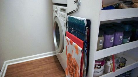 This idea is so simple that a tutorial is unnecessary.Basically it's:Multiple garden flags + repurposed pants hanger = instant flag storage! Old Dresser Drawers, Pants Hanger, Beautiful Kitchen Cabinets, Mother Daughter Projects, Coat Pegs, Burlap Garden Flags, Padded Hangers, Hanger Diy, Paint Storage