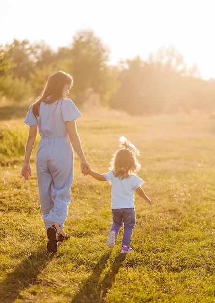 Free photo young mother and daughter, hu... | Free Photo #Freepik #freephoto #daughter #mother-daughter #young-mother #mother-child Mother Playing With Child, Good Mother Aesthetic, Mother And Daughter Holding Hands, Mother And Daughter Aesthetic, Mother And Daughter Hugging, Art Wishlist, Mother And Children, Golden Field, Mothers And Daughters