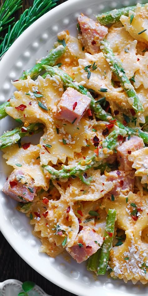 Creamy Ham Pasta with Garlic Parmesan Sauce and Asparagus on a white plate. Pasta Ham Recipes, Pasta With Ham Recipes, Dinner Ideas With Asparagus, Ham And Mushroom Pasta, Ham Peas And Pasta, Ham Pasta Recipes, Pasta With Ham, Farfalle Pasta Recipes, Pasta Ham