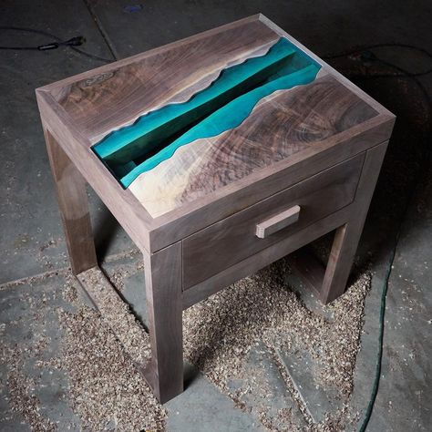 The Granite Creek Nightstand. The design features a figured black walnut top and a half inch thick glass river. I will do a video of the finish application soon! Resin Nightstand, Wood Resin Table, Carpentry And Joinery, Wood Projects For Beginners, Unique Coffee Table, Salvaged Wood, Creative Furniture, Woodworking Wood, Resin Table