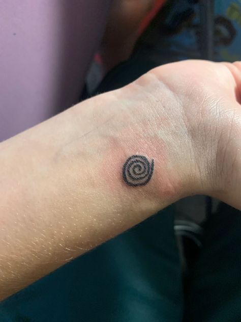 Tattooed spiral design Spiral Wrist Tattoo, Blue Spiral Tattoo, Spiral Tattoo Placement, Spiral Hand Tattoo, Swirl Tattoo Spirals, Organic Tattoo Design, Spiral Sun Tattoo, Spiral Tattoo Ideas, Koru Tattoo