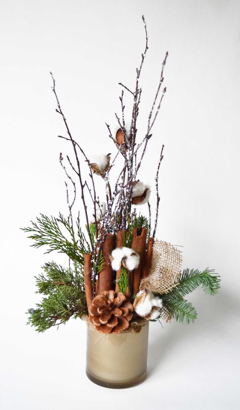 Who else is in love with #natural #cotton #bolls? They add an extra wintery touch to this festive arrangement, and their soft #texture contrasts with the spiny #pinecones and #evergreen branches. #jpparkerflowers #winter #gold #burlap #rustic Winter Floral Arrangements Home, Winter Floral Arrangements, Christmas Vases, Winter Arrangements, Winter Centerpieces, Christmas Bouquet, Holiday Arrangement, Winter Bouquet, Christmas Floral Arrangements