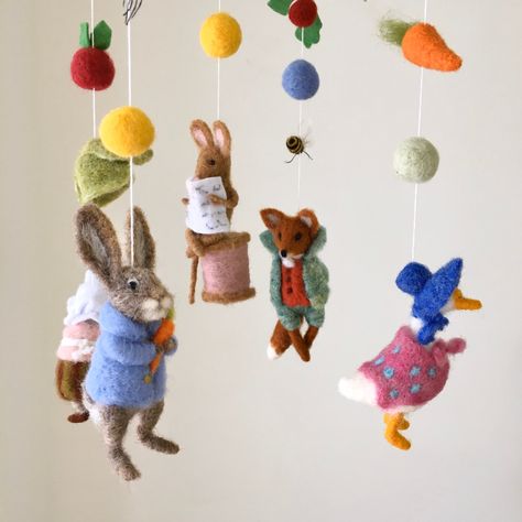 ♥ This eco natural baby mobile with characters from the tale of the Peter rabbit will be a good addition for the nursery. Each element of this mobile is created with highest quality pure wool. This baby mobile is a perfect gift for a baby Newborn celebration. Your little one will delight in watching this little cuties. You can hang the mobile over the baby crib or over your baby's changing table. There is a loop at the top of the item for hanging which you can use to hang from a crib holder or f Fairytale Baby Shower, Beatrix Potter Nursery, Peter Rabbit Nursery, New Parents Gift, Rabbit Nursery, Fairytale Nursery, Rabbit Sculpture, Rabbit Gifts, Expecting Mom Gifts