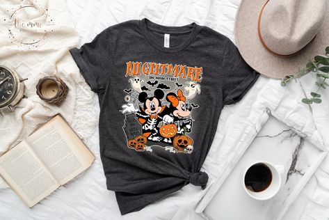 This Gender-Neutral Adult T-shirts item is sold by TheMMCBoutique. Ships from United States. Listed on Sep 10, 2023 Vintage Disney Halloween, Disney World Shirts, Shirts Vintage, Halloween Shirts, Disney Shirt, Disney Halloween, Halloween T Shirt, Disney Shirts, Mickey Minnie