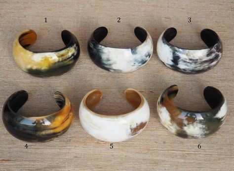 "This beautiful bracelet cuff is handcrafted 100% from natural buffalo horn material. Height: 4.5 - 5.0 cm (1\"90 - 2\"), with opening about 1\"20 (3.0 cm) Finish: polish. Diameter (inner): *Size S (Small): 2\"10 - 2\"20 (equal to 6.0) *Size M (Medium): 2\"50 equal to 6.5 cm . *Size L (Large): 2\"75 equal to 7.0 cm. Each piece of natural horn has its own color variation which make it unique. We will send a color similar to this item or similar to your choice. If you want please just request for Horn Bracelet, Horn Pendant Necklace, Horn Earrings, Boho Bangle, Gold Bracelet Set, Horn Jewelry, Horn Pendant, Stacked Bangles, Pretty Bracelets