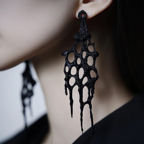 These dramatic 3D printed earrings are designed for those who embrace bold fashion with a Gothic twist. The intricate web-like structure flows into elongated, dripping elements, creating a striking visual impact. Perfect for Halloween or as statement jewelry for dark, artistic styles. Crafted from lightweight black resin, they offer comfort while delivering bold elegance. Hypoallergenic stainless steel posts ensure they are suitable for sensitive skin. Gothic Designer Fashion, Resin 3d Printed Jewelry, 3d Printed Earrings Design, 3d Printed Accessories, Drippy Earrings, 3d Print Earrings, 3d Print Jewelry, 3d Printing Jewelry, 3d Printer Jewelry