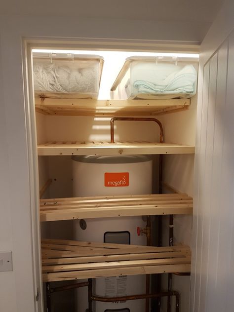 Airing cupboard shelving made in modules so that they can be easily removed Airing Cupboard Organisation With Boiler, Hot Press Organisation, Boiler Room Storage, Hot Water Tank Cupboard Storage Ideas, Small Boiler Cupboard Storage, Small Airing Cupboard Storage, Hot Press Shelving Ideas, Airing Cupboard Shelving Ideas, Diy Airing Cupboard Shelves