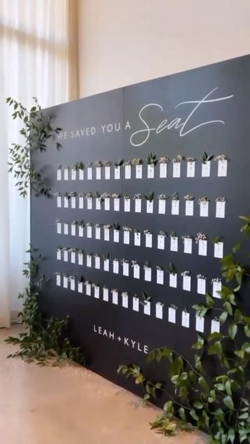 Carats & Cake on Instagram: "Florals for an escort card display? Actually, groundbreaking. Gift your guests a personalized, in-bloom escort card to add freshness to a photo-worthy display while informing them of their seat (double duty!). See even more innovative ideas for escort card displays by clicking the link in our bio. #caratsandcake 💌: @letteredbyvalerie 📋: @bluesparrowevents 💐: @remiandgold" City Wedding Decor, Creative Seating Cards, Unique Seating Chart Wedding, Bridal Party Color Schemes, Moodboard Wedding, Bridal Parties Colors, Card Displays, Trending Wedding, Lily Wedding