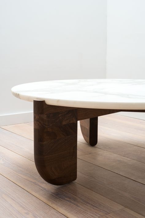 The Tripod Coffee Table is an exploration of material, texture and form. The base and top were designed to fit together as one, with the bottom curve of the stone seated neatly in the inverse curve of the wooden legs. This piece is artisan-made in our New York workshop from hand selected black walnut and the highest quality of Calacatta marble. Axel Vervoordt Coffee Table, Four Hands Coffee Table, Coffee Table Marble Wood, Marble Table Base, Wood And Stone Coffee Table, Stone And Wood Coffee Table, Wood And Marble Coffee Table, Marble Wood Coffee Table, Marble Wood Table