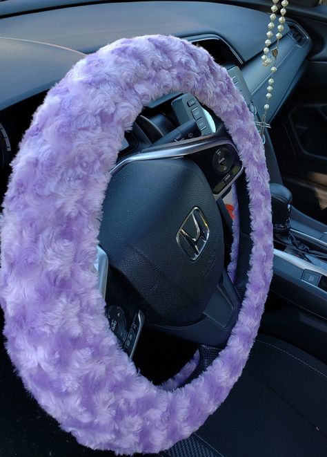 Soft and fuzzy purple steering wheel cover keeps your hands warm and comfortable on cold days. #purple #fuzzy Purple Car Steering Wheel, Lavender Steering Wheel Cover, Purple Inside Car, Purple Car Interior Accessories, Purple Car Aesthetic Inside, Purple Car Ideas, Purple Steering Wheel Cover, Light Purple Car Accessories, Lilac Car Interior