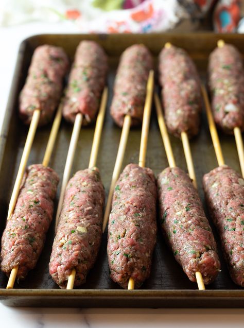 Ground beef mixture shaped on wooden skewers, all laying in rows on a baking sheet. Kafta Kebab, Kafta Kabobs, Kafta Kabob Recipe, Beef Kafta, Mediterranean Beef, Gyro Meat Recipe, Sausage Kabobs, Beef Gyro, Beef Kebabs