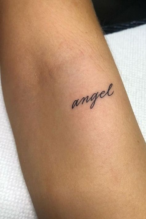 Tattoo Ideas Female Coquette, Name Tattoo Aesthetic, Angel Tramp Stamp Tattoos, Cursive Tramp Stamp, Princess Tramp Stamp, Angel Tattoo Aesthetic, Angel Writing Tattoo, Soft Girl Tattoos, Angel Tramp Stamp