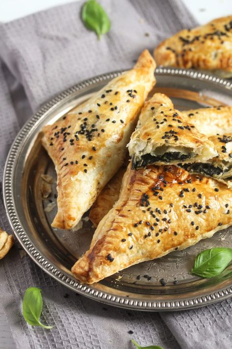 Crispy feta and spinach triangles, Greek-style, these little parcels are made with puff pastry and are filled with a delicious cheese, spinach, and herb mixture. #whereismyspoon #fetaspinachparcels #fetaspinachtriangles #minispanakopita #puffpastrytriangles #puffpastryappetizers Spinach Feta Cheese Puff Pastry, Puff Pastry Spanakopita Recipe, Puff Pastry With Feta Cheese, Spinach Feta Pastries, Spinach Feta Pastry, Feta Spinach Puff Pastry, Spinach And Feta Puff Pastry, Feta And Spinach Puff Pastry, Spinach And Feta Pastry