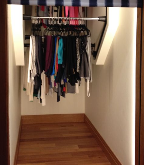 Vertical revolving clothes for closet. Great Idea for understairs seasonal storage or coat storage! Under Stairs Storage Closet Coats, Under Stairs Clothing Closet, Under Stair Clothes Closet, Stairway Closet Ideas, Under Stairs Coat Storage, Narrow Coat Closet, Deep Coat Closet, Coat Closet Ideas, Stairs Closet