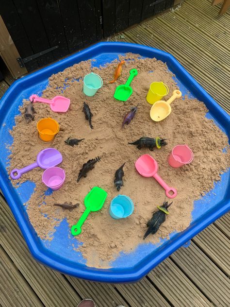 Small sand play with tiny plastic buckets, spades and dinosaur figures. Sand Tray Ideas, Dinosaur Figures, Sand Tray, Sand Play, Tray Ideas, Plastic Buckets, Dinosaurs Figures, Pre School, Buckets