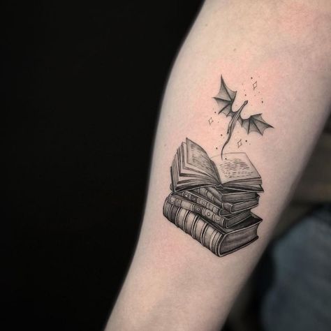 Fantasy Reading Tattoo, Tattoo Idea For Book Lovers, Book Tattoos With Dragons, Bookish Tattoos Dragon, Bookish Dragon Tattoo, Book With Dragon Tattoo, Tattoos For Fantasy Book Lovers, Realism Book Tattoo, Forearm Book Tattoo