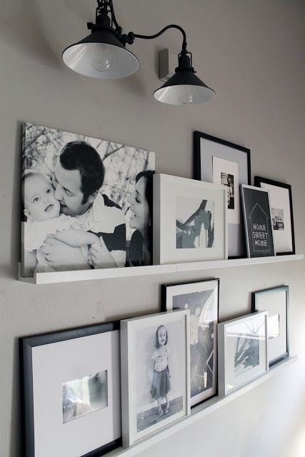 Such a cute gallery wall alternative. Like how they worked with the sconce too. | Chris Loves Julia: Photo Ledges O Fun Photo Ledge, Koti Diy, Framed Photos, Picture Ledge, Floating Shelves Diy, Foto Tips, Picture Hanging, Wall Gallery, Banquette