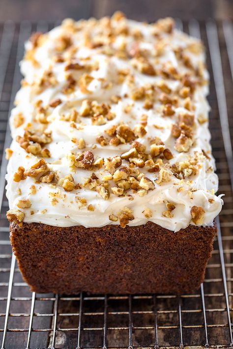 This sweet, moist carrot cake loaf is a simple twist on traditional carrot cake, filled with spices and topped with rich cream cheese frosting! | thecozyapron.com #carrotcakeloaf #carrotcakeloafrecipe #carrotcakeloafhealthy #carrotcakeloafbread #carrotcakeloafmoist #carrotcakeloafrecipeeasy #carrotcakeloafpan #carrotcakeloafwithcreamcheese Carrot Cake Loaf Recipe, Carrot Cake Bread, Carrot And Walnut Cake, Walnut Loaf, Carrot Cake Loaf, Cake With Cream Cheese Icing, Carrot Banana Cake, Quick Bread Recipes Easy, Moist Carrot Cakes