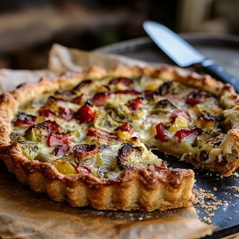 Savourez cette tarte rustique aux poireaux, une recette automnale pleine de saveurs et de simplicité. Sa pâte dorée et croustillante renferme une garniture de poireaux délicieusement fondants. Idéale pour un repas d'automne, cette tarte se sert aussi bien chaude que froide, ce qui en fait un plat versatile pour vos dîners entre amis ou vos repas en famille. Essayez-la pour apporter une touche de rusticité et de chaleur à vos tables d'automne ! Savory Pie, Pies & Tarts, French Food, Pesto, Tart, Vegetarian Recipes, Food And Drink, Pizza, Yummy Food