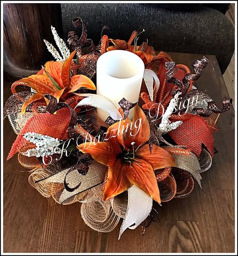 Decorate your home with the beautiful burnt orange, cream and chocolate deco mesh colors. This arrangement is also great for the fall time. It is made on a wired wreath form with high-quality burnt orange, chocolate, burlap and cream deco mesh. It shows with burnt orange, chocolate and cream ribbons with orange Flex tubing bows. Measuring 15 inches this arrangement can ship it out within 5 to 7 business days after purchase. Please note that the candle in this arrangement is not included and is f Fall Deco Mesh Centerpieces For Table, Business Centerpieces, Orange Christmas Decor, Autumn Centerpieces, Deco Mesh Pumpkin, Decorated Candles, Scary Halloween Decorations Diy, Candle Wreath, Orange Lily