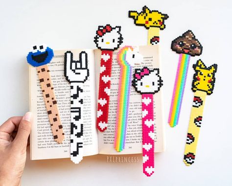 Lets make reading even more fun with these sooooo cute new bookmarks ♡ My favorites are the poop, the rock sign and the pika, which is… Perler Anime, Nerdy Perler Beads, Melt Beads Patterns, Rock Sign, Hamma Beads Ideas, Pokemon Bead, Perler Creations, Pearl Beads Pattern, Hama Beads Design