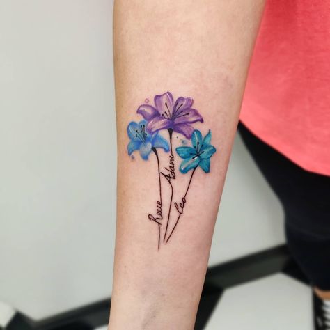 30+ Inspirational and Cute Kids Name Tattoo Ideas for 2023 - 100 Tattoos Grandkid Name Tattoos, Tattoo Of Grandkids Names, Beautiful Name Tattoos, Birth Flower With Initial Tattoo, Tattoo Ideas For Grandchildren Names, Tattoo For 3 Daughters, Children’s Tattoo Ideas, 3 Names Tattoo Ideas For Women, Tattoo Kids Names For Women