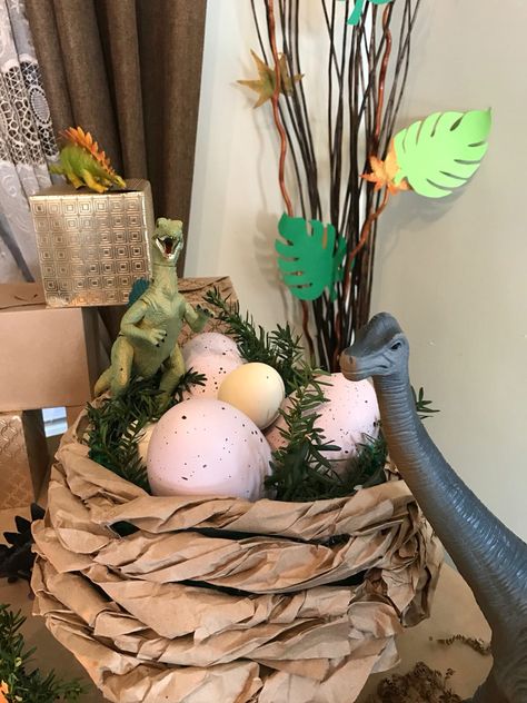 Dinosaur nest decor Dinosaur Themed Decorations, Dinosaur Egg Decor, Dinosaur Decorating Ideas, Dinosaur Props Diy, Dino Theme Party Decor, Dinasour Decorations, Jurassic Park Decoration, Jurassic Park Classroom Door, Dinosaur Halloween Decorations