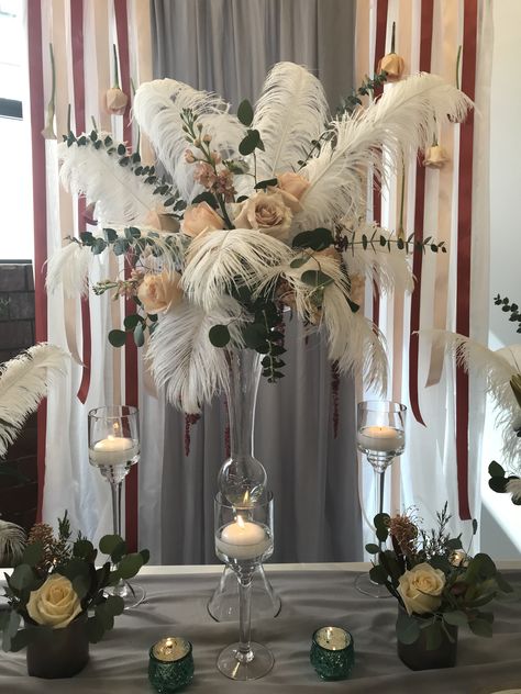 Wedding Table Decorations Feathers, Flowers With Feathers Centerpieces, Flower Feather Centerpieces, Feather Birthday Decorations, Bridal Shower Masquerade Theme, Ostrich Feathers And Flowers Centerpiece, Ostrich Feather And Flower Centerpiece, Ostrich Feather Wedding Decor, Masquerade Flower Centerpieces