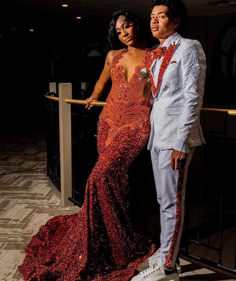 Black And Orange Prom Couple, Orange Tuxedo Prom, Rust Orange Prom Dress, Orange Prom Dresses Black Women, Orange Prom Suit, Orange Prom Couple, Burnt Orange Prom Dress, Baddie Prom Dresses, Baddie Prom