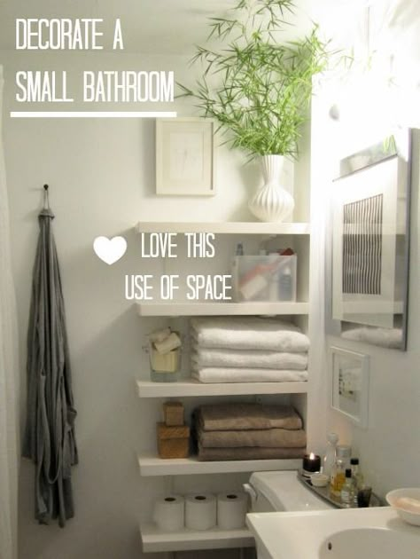 Floating shelves create space in the   narrow area by toilet (just remember there are lots of germs in this   area). Small Downstairs Toilet, Small House Decorating, Downstairs Toilet, Real Estat, Bad Inspiration, Chic Living, Bathroom Renos, White Towels, House Bathroom