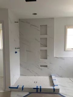 Shower Wall Ideas Solid Surface, Corian Bathroom Showers Solid Surface, Marble Shower Panels, Silestone Shower Walls, White Quartz Shower Walls, White Cultured Marble Shower Walls, Corian Shower Walls Walk In, Solid Panel Shower Walls, Bathroom Slabs Design