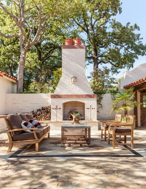 An outdoor fireplace is a great way to create ambiance for a patio living room. #patiolivingroom #patiodesignideas #patioideas #patiofireplace #mediterraneanpatio #patios Spanish Courtyard, Mediterranean Patio, Spanish Decor, Build A Fireplace, Spanish Villa, Plans Architecture, Spanish Style Home, Mediterranean Decor, Spanish Style Homes