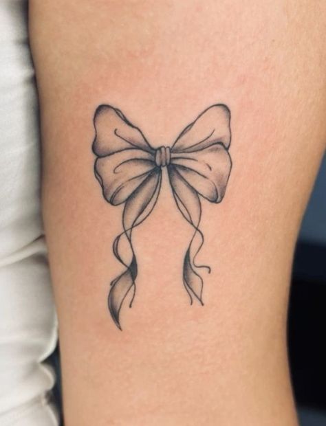 Pretty Bow Tattoo, Bow On Hip Tattoo, Vintage Bow Tattoo, Bow Tattoo On Thigh, Back Of Thigh Bow Tattoo, Bow Ankle Tattoo, Bow Tattoo Meaning, Bow Lower Back Tattoo, Bow Tattoo Designs Ribbon