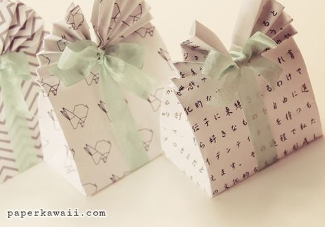 Learn how to make these cute origami gift bags! Easy to follow video tutorial. Perfect as easter gift box, party favour, wedding favour! Origami Paper Bag, Origami Gift Bag, Origami Box Tutorial, Paper Kawaii, Wallpaper Crafts, Easter Gift Boxes, Origami Gifts, Origami Wedding, Cute Origami