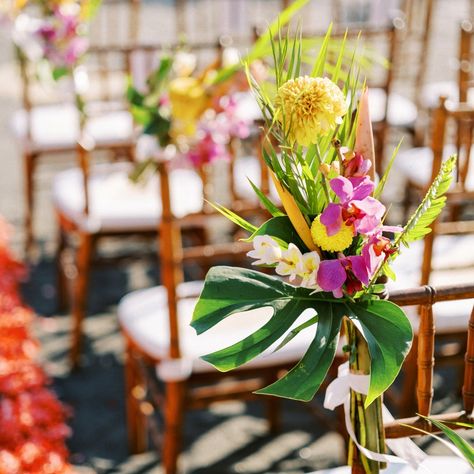 Talk about making an entrance. The aisle started with stunning flower arrangements on pillars, blending tropical and boho vibes perfectly. Local blooms like orchids, frangipani, and anthuriums in soft whites, blush, coral, and flamingo, with lush palm leaves adding that pop of green. Dreaming of a wedding this vibrant? We can make it happen ❤️ Planner: @bali.loveweddings Venue: @villavedasbali Florist: @natafloristbali Furniture & Decor: @balisewasewa, @balieventhire Photobooth: @baliphot... Boho Vibe, Make It Happen, Palm Leaves, Photo Booth, Talk About, A Wedding, Blending, Florist, Flamingo