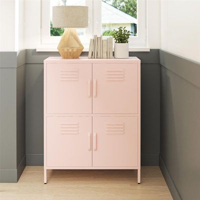 This clean-lined accent cabinet features a locker-style design and extra storage for a mid-century modern look we love. Four cabinet doors conveniently open up to lots of shelf space, giving you room for everything from books and board games to cleaning supplies and pantry items. This cabinet is crafted from powder-coated steel in a neutral hue of your choice, and it rests on slim legs for a sleek feel. Rubber pads on the bottom of the feet prevent scratches and scrapes on your floor. Plus, it c Door Locker, Door Metal, Barbie Dreamhouse, Accent Storage Cabinet, Door Accent Cabinet, Accent Chests And Cabinets, Accent Storage, Metal Lockers, Metal Cabinet