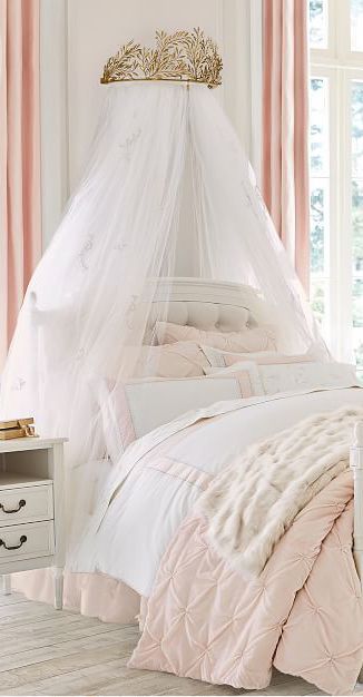 Fit for royalty! Give their sleeping space a regal accent with this cornice. This collaboration with renowned fashion designer Monique Lhuillier invites magic to the nursery and bedroom. This ethereal collection is inspired by her own experience as a mother creating nurseries and bedrooms for her children. #kidsbedrooms #girlsbedrooms #girlsbedroomideas Pottery Barn Kids Blythe, Ballerina Bedroom, Girls Canopy, Princess Bedrooms, Princess Canopy, Bed Crown Canopy, Bed Crown, Dreamy Decor, Princess Bedroom