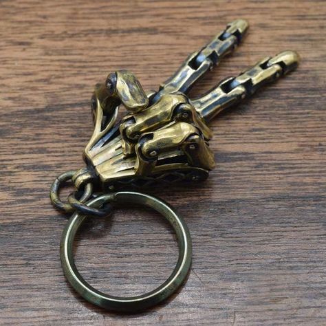 "\"LEFT HAND keyring\"  The hand closest to the heart.  It is movable with five fingers, but cannot be fixed with a hand sign.  This keyring is made in Japan.  Height⇒55㎜(2.16in) Ｗidth⇒55㎜  Weight⇒34g  Material⇒Brass  ※This item may take more than 20 days to ship." Jewelry Smithing, Chain Pants, Mecha Design, Pant Chains, Film Ideas, Steampunk Aesthetic, Pocket Tool, Hand Sign, Paracord Diy