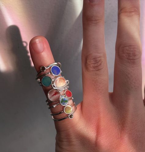 a stunning space ring set!
this solar system set contains 9 rings, representing all the planets
rings can be weared all at once (as stackable rings) or separately
made of sterling silver, each planet is hand painted with enamels Planet Rings, Space Ring, All The Planets, Planet Ring, Space Rings, Space Jewelry, The Planets, Enamels, Jewelry Silver